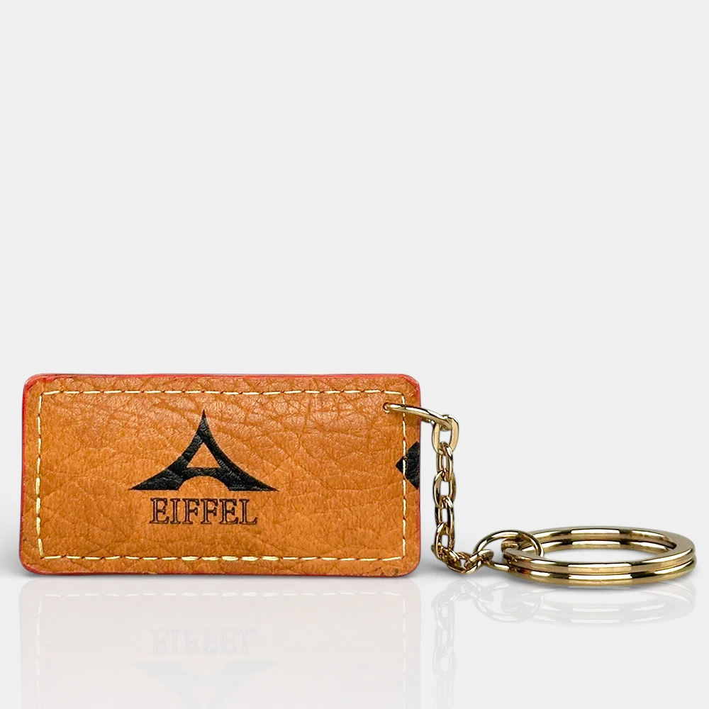 Μπρελόκ γυναικείο La Tour Eiffel ταμπά με χρυσό κρίκο και ανάγλυφο λογότυπο