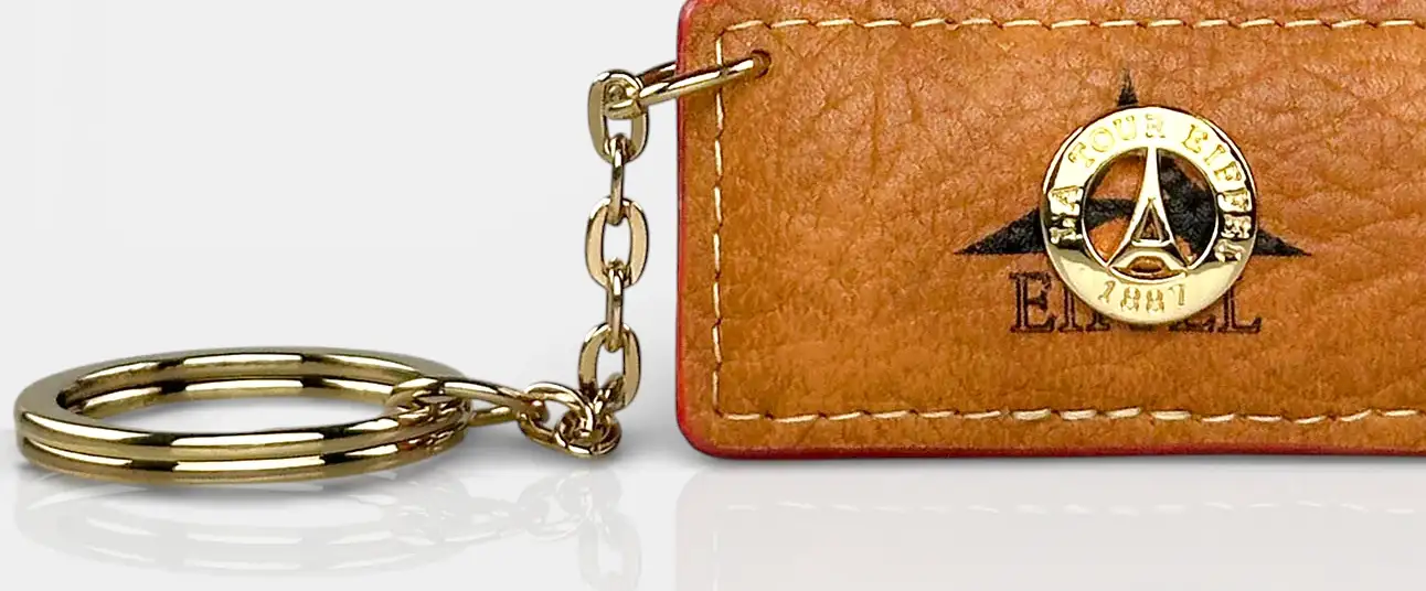 Μπρελόκ γυναικείο La Tour Eiffel ταμπά με χρυσό κρίκο και ανάγλυφο λογότυπο