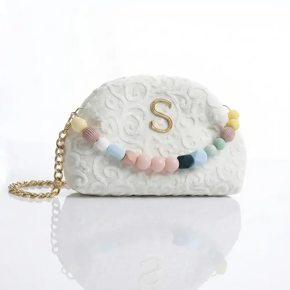 χειροποίητη τσάντα Sorena Oraiozili Mini bucket bag με χρυσή αλυσίδα και minimal σχεδιασμό